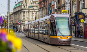 A Luas light rail tram going down Abbey St in Dublin city centre.