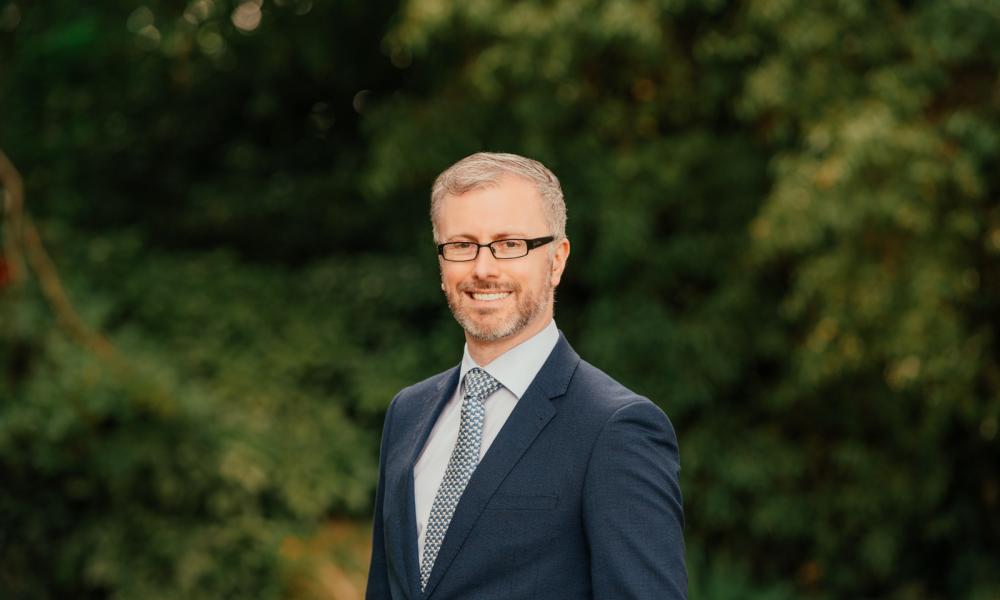 Profile photo of Minister Roderic O'Gorman with trees in the background