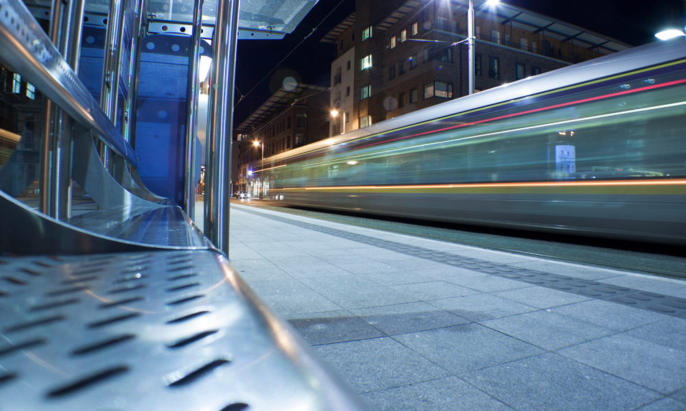 A Luas tram goes past a station in Dublin.