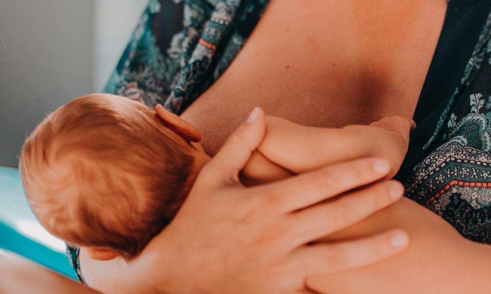 Woman breast feeding her baby