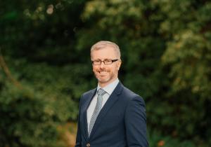 Profile photo of Minister Roderic O'Gorman with trees in the background