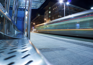 A Luas tram goes past a station in Dublin.