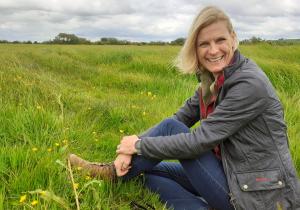 Pippa Hackett in field of clover