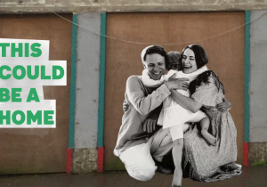 This could be a home - image of a young family infront of a derelict building