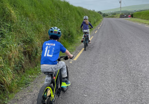 Children cycle down a country road, Co Kerry