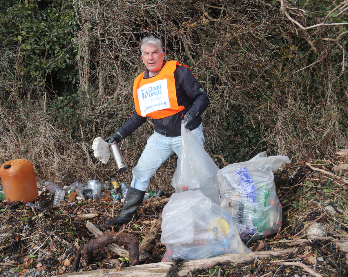 Jody Power picking up litter in his community